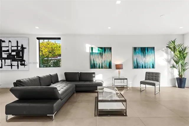 a living room with furniture kitchen and a sink