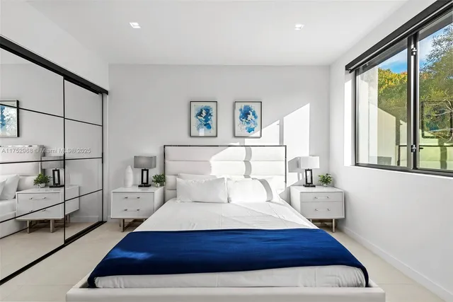 a bathroom with a tub and a window