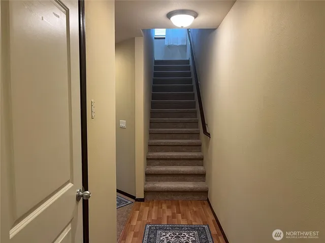 a view of entryway with wooden floor