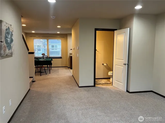 an empty room with furniture and a window