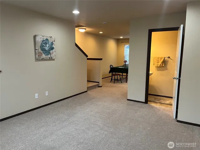 an empty room and a refrigerator in a room