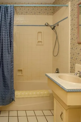a bathroom with a sink and a shower