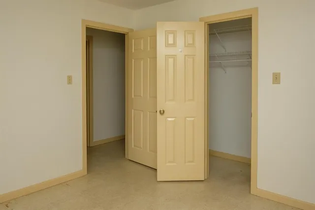 a view of a kitchen with a sink cabinets and a wooden floor