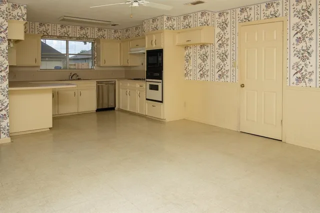 a bathroom with a sink a mirror and a shower