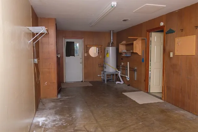 a view of a house with backyard and garden