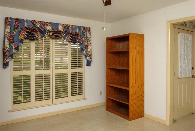 a view of front door with wooden door
