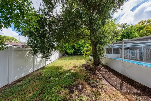 a house view with a sitting space and garden space