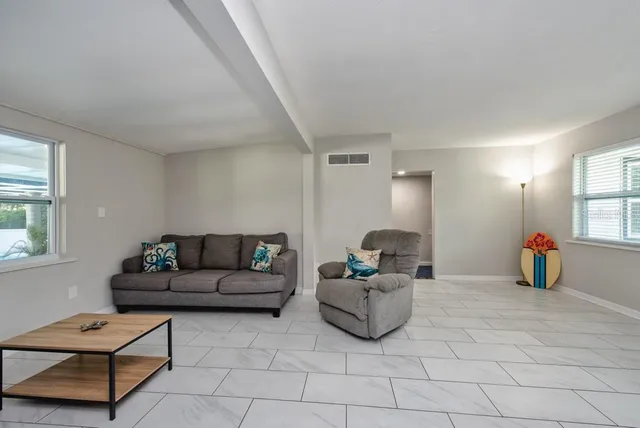 a living room with furniture and a window