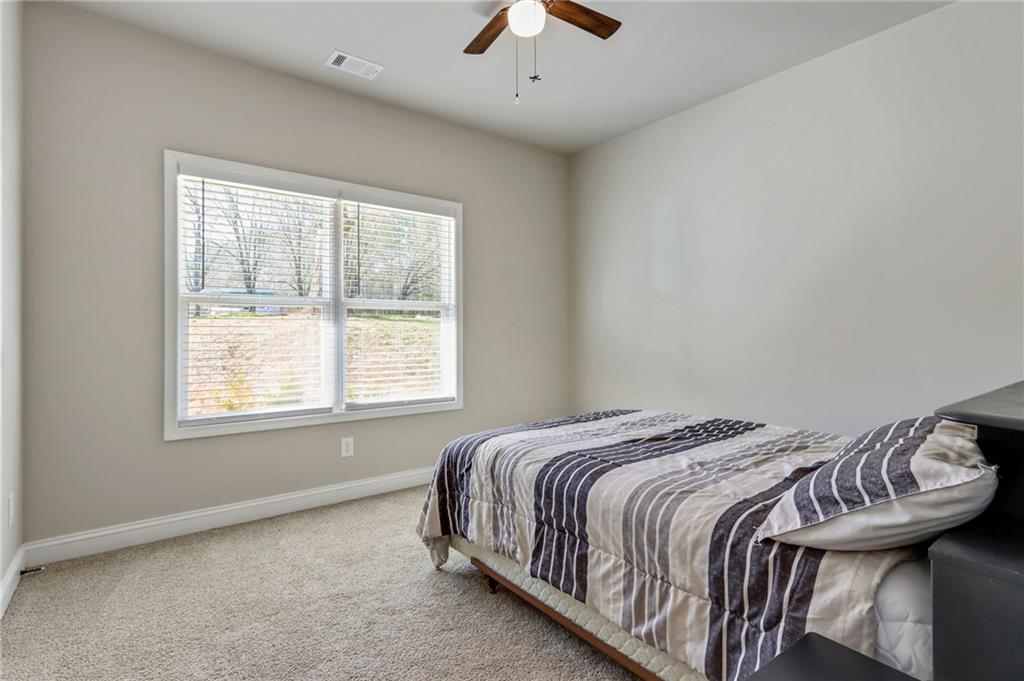 391 Mulberry Rock Road Temple, GA 30179 - Photo 17 of 25 a bedroom with a bed and a window