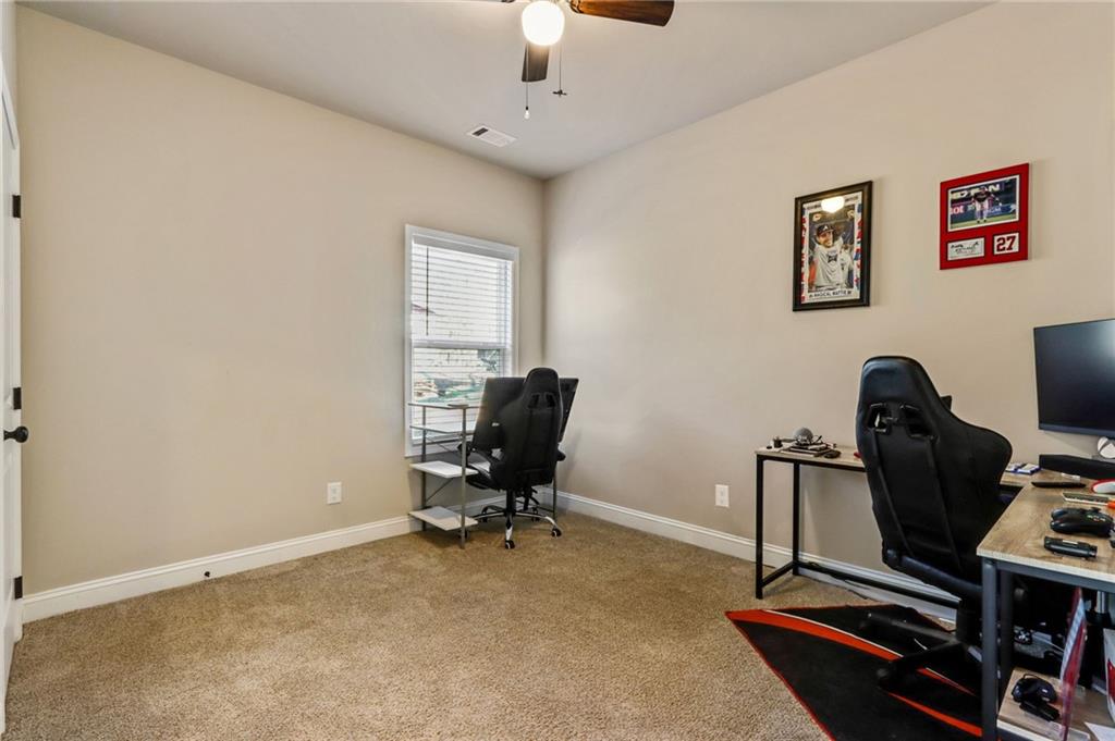 391 Mulberry Rock Road Temple, GA 30179 - Photo 20 of 25 a view of a workspace with furniture and a window