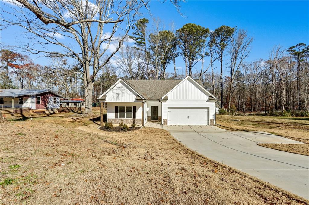 391 Mulberry Rock Road Temple, GA 30179 - Photo 2 of 25 a view of house with outdoor space and sitting area