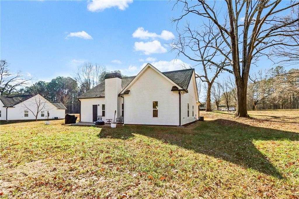 391 Mulberry Rock Road Temple, GA 30179 - Photo 24 of 25 a view of a house with a yard covered with snow in front of it