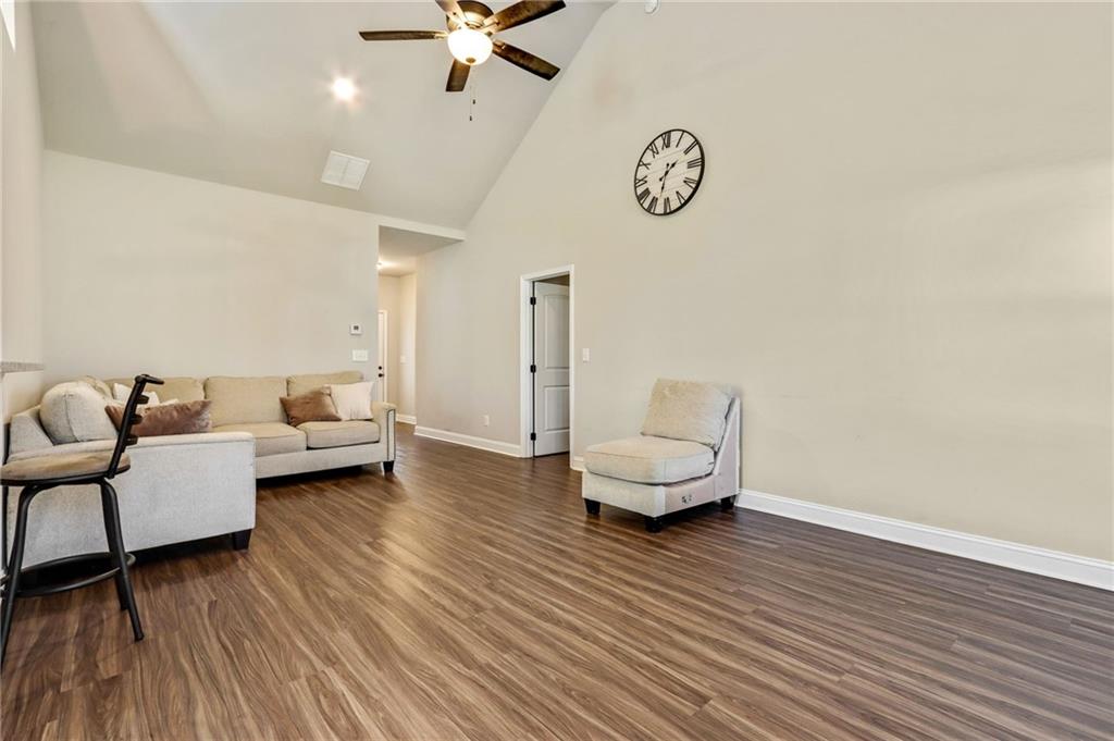 391 Mulberry Rock Road Temple, GA 30179 - Photo 7 of 25 a living room with furniture and a wooden floor