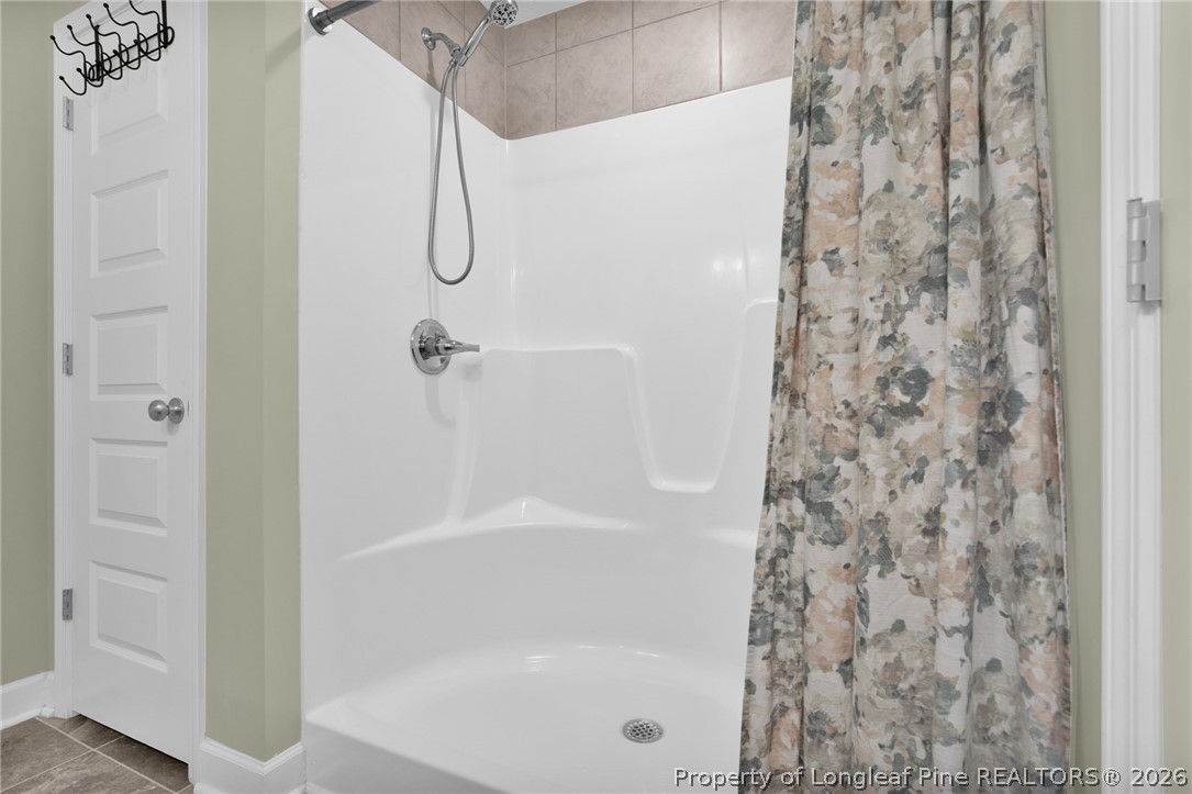 351 Sandy Grove Road Parkton, NC 28371 - Photo 22 of 30 a bathroom with a bath tub