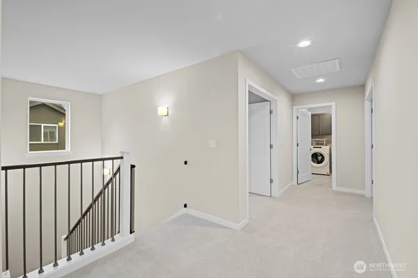 a view of a hallway with closet area