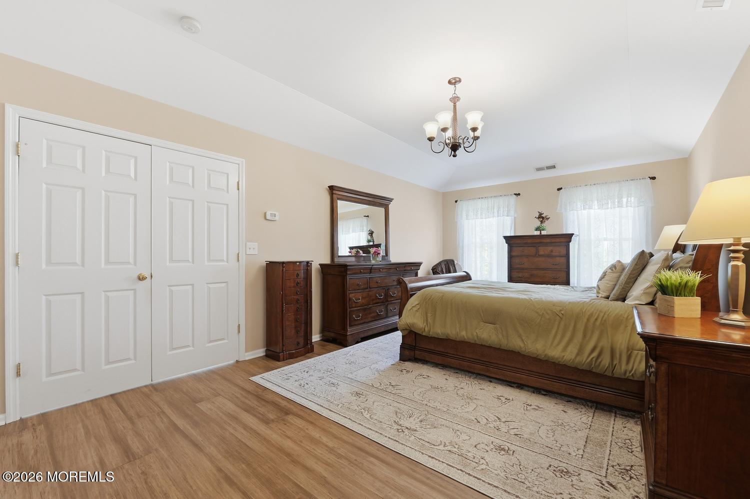 7 Cherry Tree Lane Cream Ridge, NJ 08514 - Photo 20 of 47 a spacious bedroom with a balcony a bed and a dresser