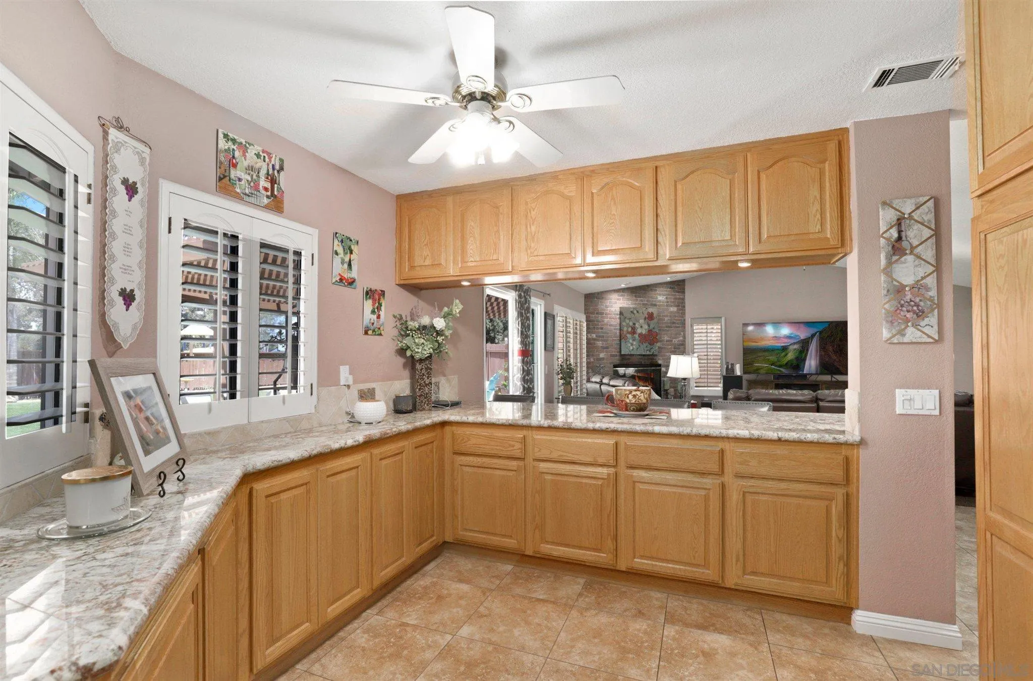 910 Redbud Road Chula Vista, CA 91910 - Photo 11 of 33 a kitchen with a sink stove and cabinets