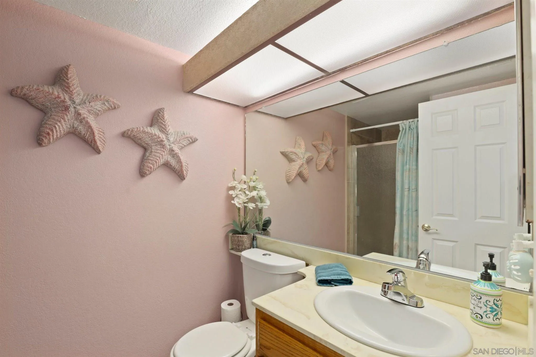 910 Redbud Road Chula Vista, CA 91910 - Photo 19 of 33 a bathroom with a sink toilet and shower