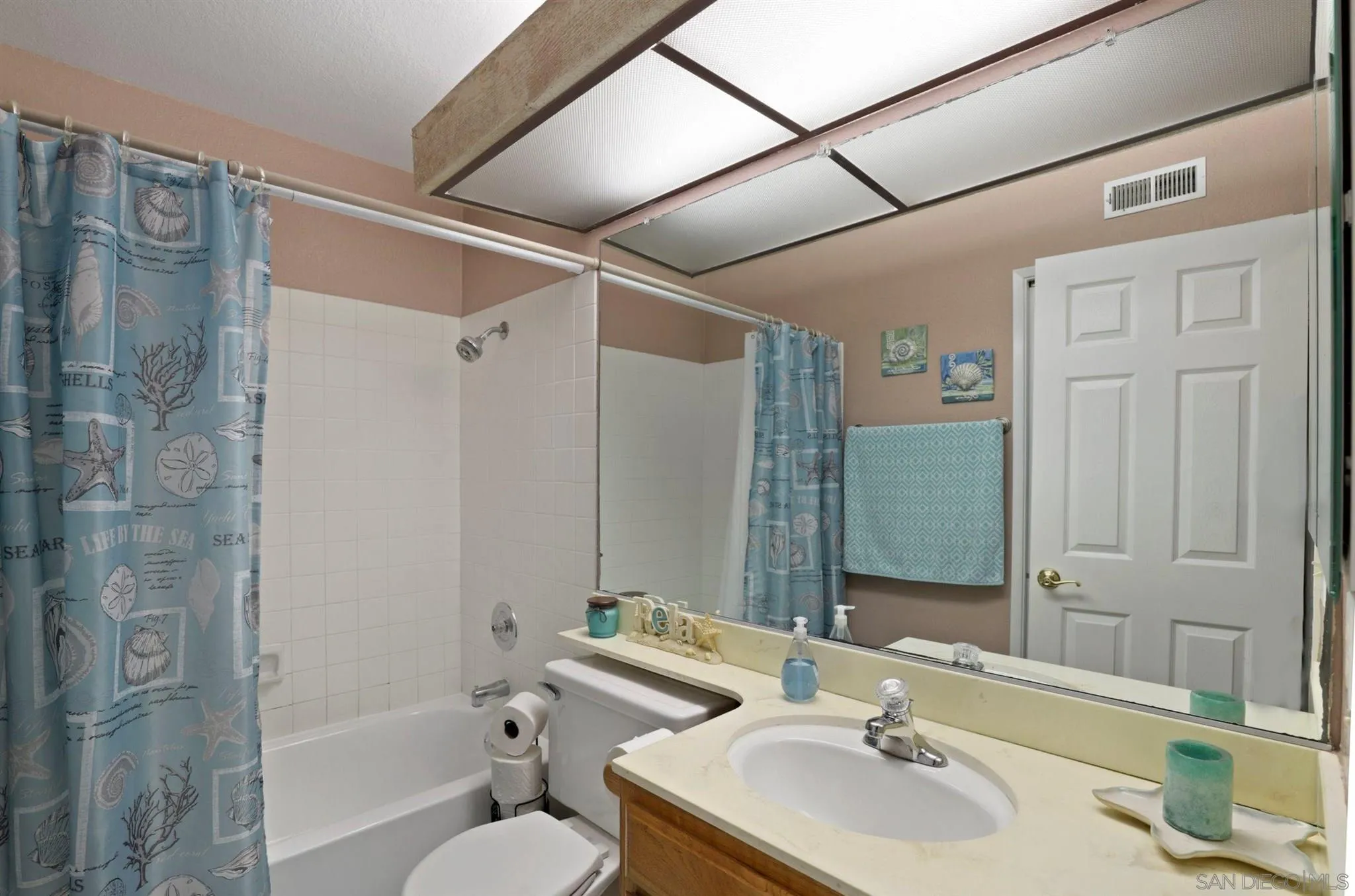 910 Redbud Road Chula Vista, CA 91910 - Photo 21 of 33 a bathroom with a granite countertop sink toilet and shower