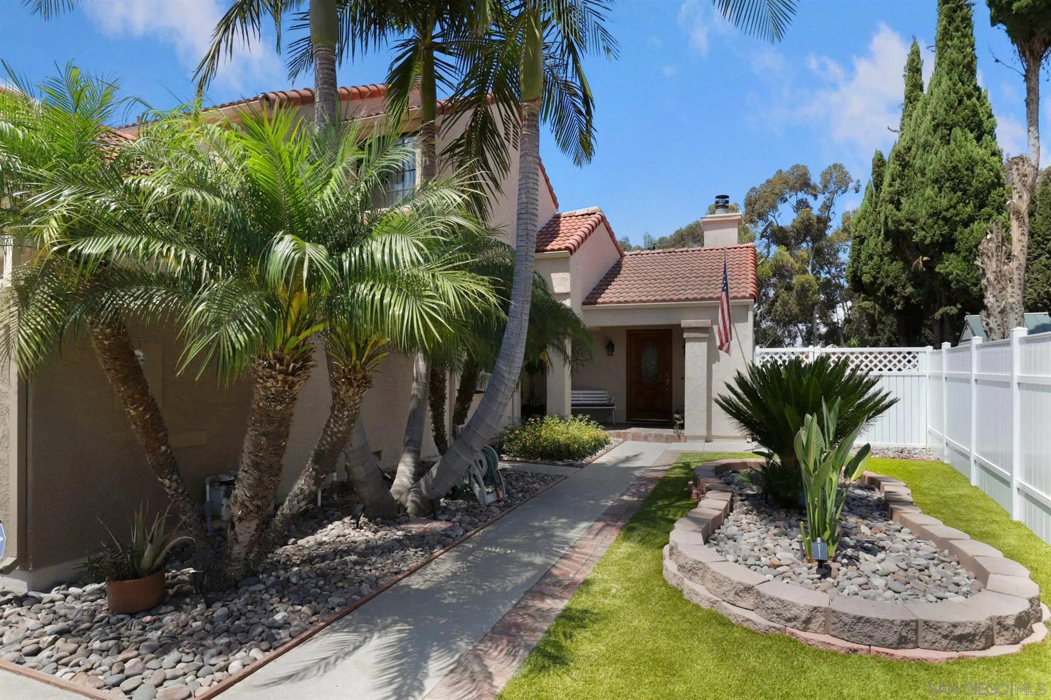 910 Redbud Road Chula Vista, CA 91910 - Photo 23 of 33 a view of a house with a yard and potted plants