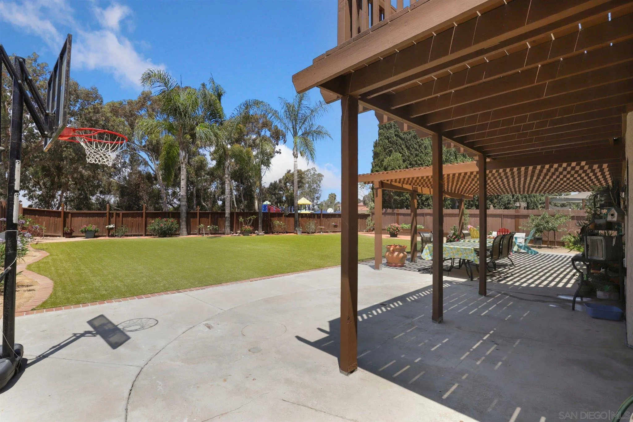 910 Redbud Road Chula Vista, CA 91910 - Photo 24 of 33 a view of a backyard with couches with wooden fence