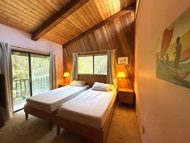 11-3763 10th Street Volcano, HI 96785 - Photo 14 of 28 a bedroom with a bed and wooden floor