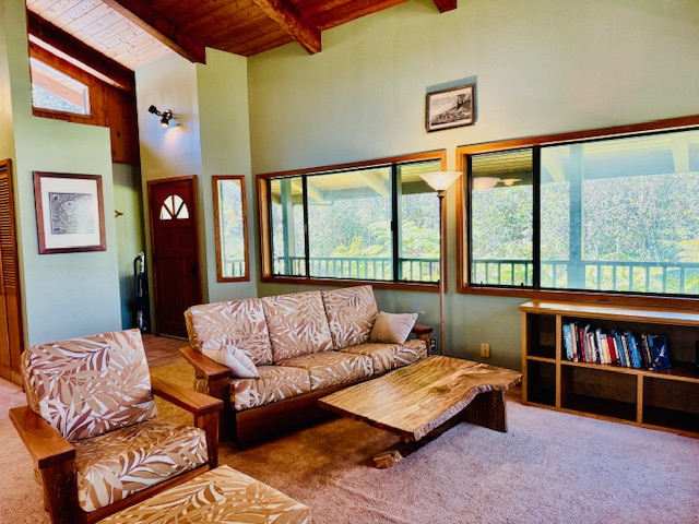 11-3763 10th Street Volcano, HI 96785 - Photo 3 of 28 a living room with furniture and a large window