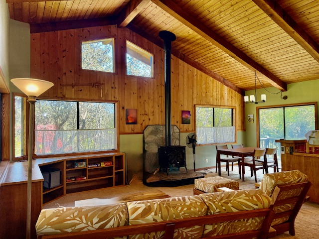 11-3763 10th Street Volcano, HI 96785 - Photo 4 of 28 a living room with furniture and a floor to ceiling window