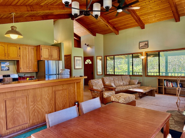 11-3763 10th Street Volcano, HI 96785 - Photo 5 of 28 a living room with furniture a large window with kitchen view