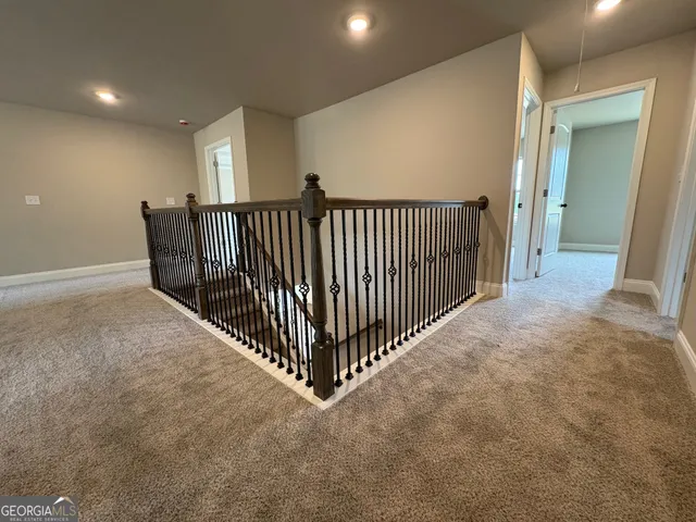 a view of a hallway with windows