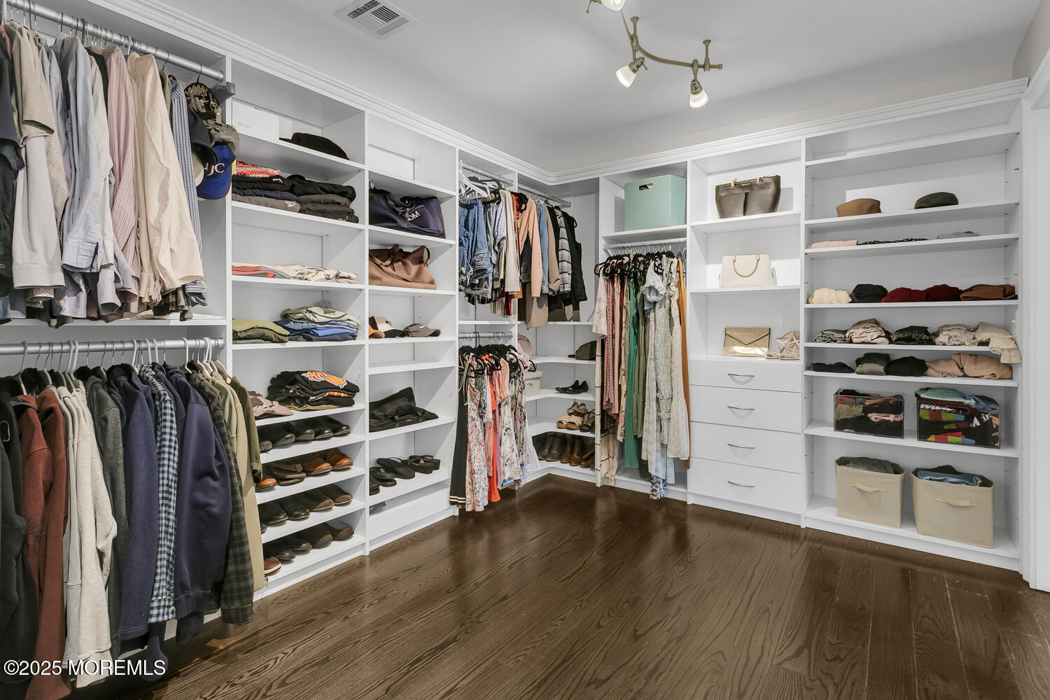 19 Old Phalanx Road Lincroft, NJ 07738 - Photo 19 of 34 a view of walk in closet with clothes and shoes