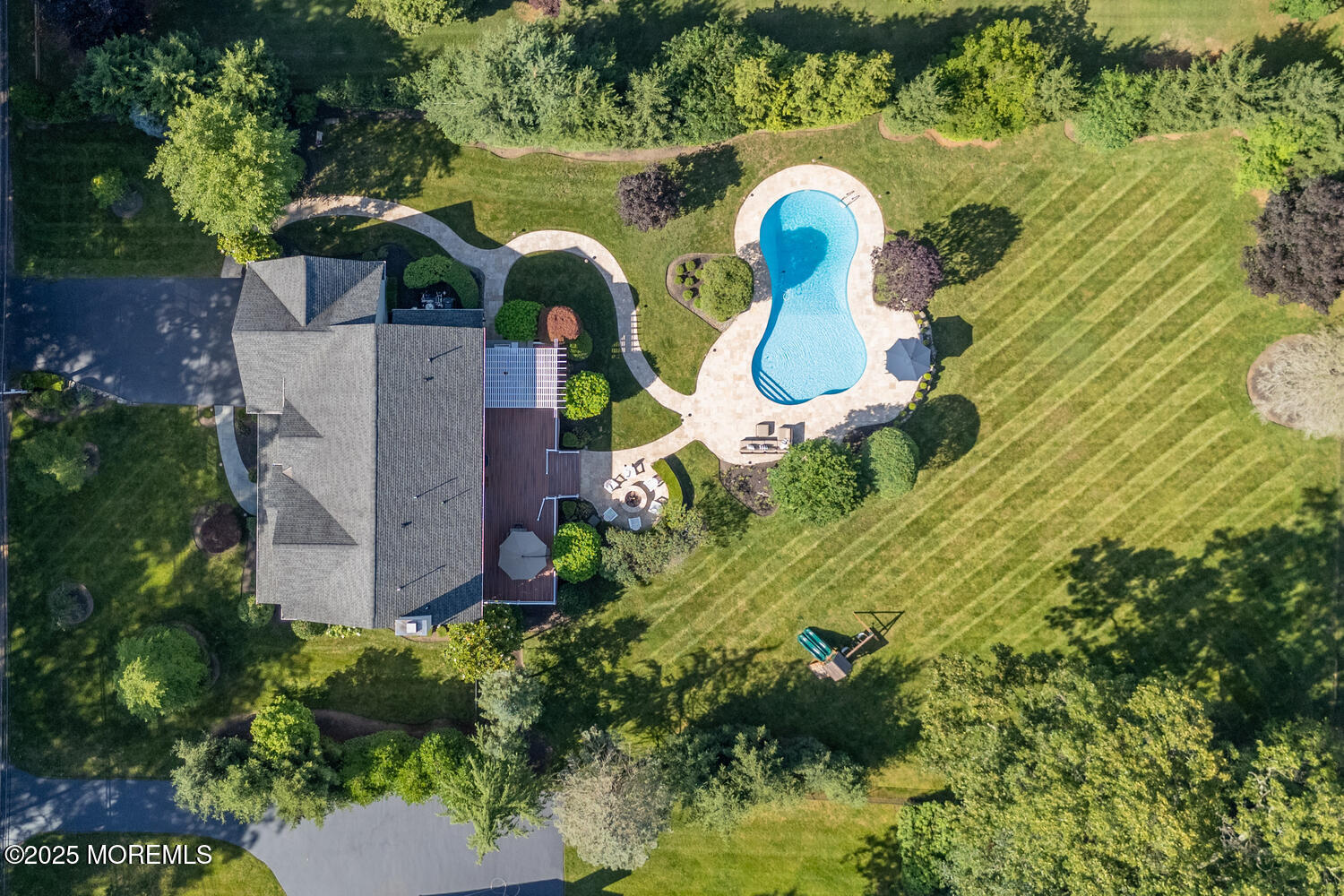 19 Old Phalanx Road Lincroft, NJ 07738 - Photo 2 of 34 an aerial view of a house with swimming pool and large trees