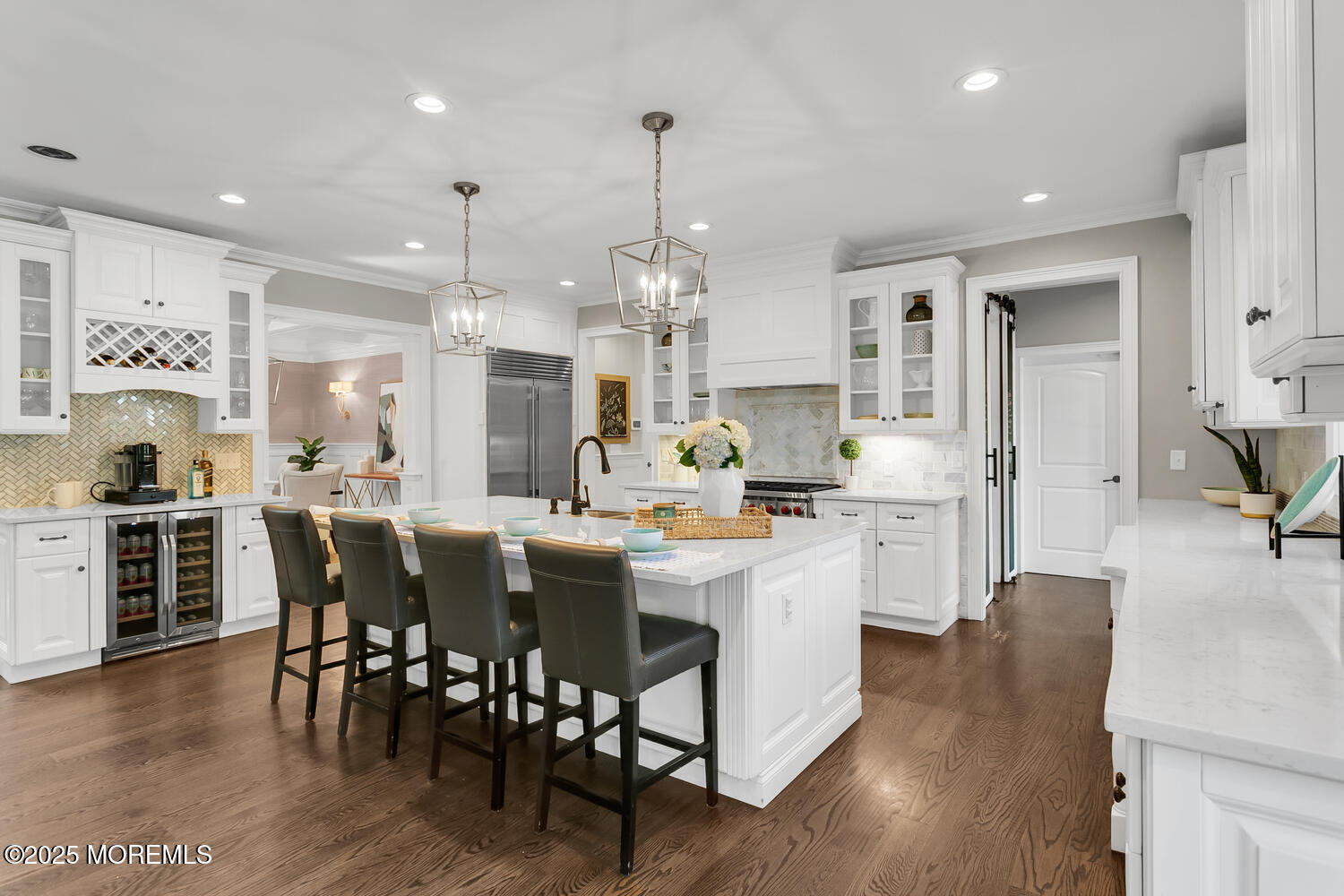 19 Old Phalanx Road Lincroft, NJ 07738 - Photo 5 of 34 a kitchen with stainless steel appliances kitchen island granite countertop a table chairs and a refrigerator