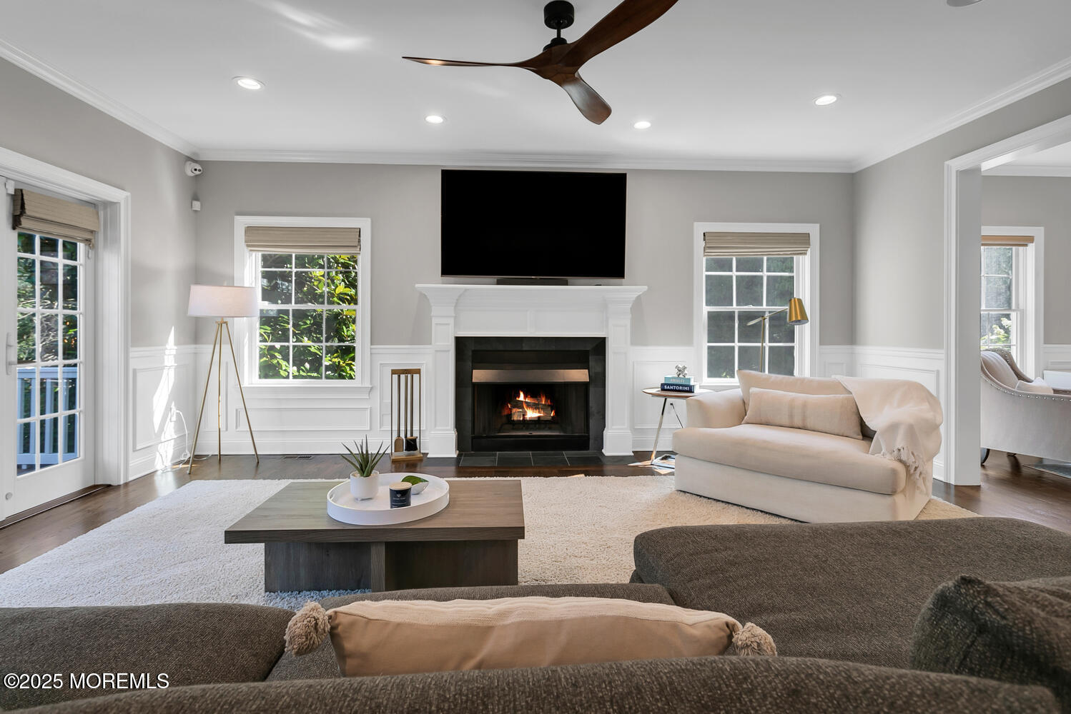 19 Old Phalanx Road Lincroft, NJ 07738 - Photo 9 of 34 a living room with furniture a fireplace and a flat screen tv