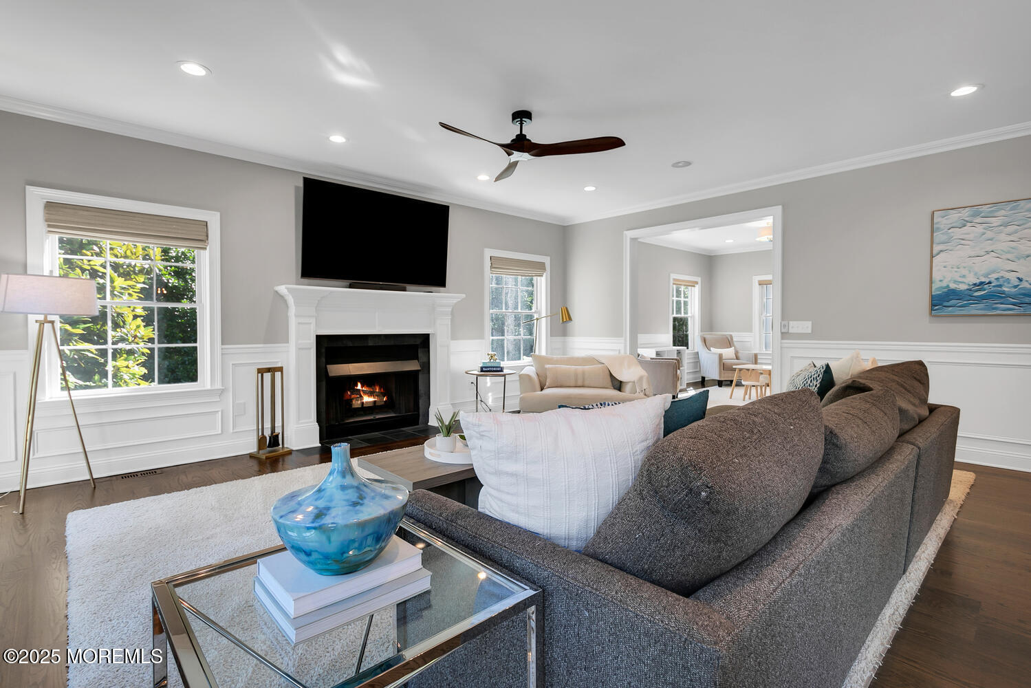 19 Old Phalanx Road Lincroft, NJ 07738 - Photo 10 of 34 a living room with furniture a flat screen tv and a fireplace