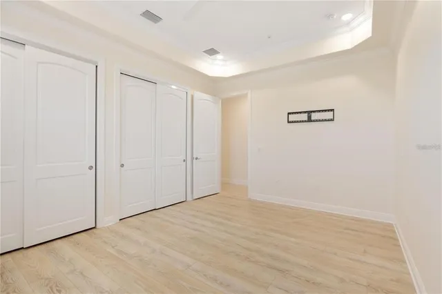 an aerial view of a house with a yard swimming pool and outdoor seating