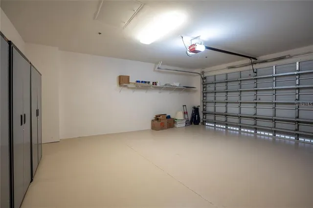 a view of a swimming pool with a patio and a yard