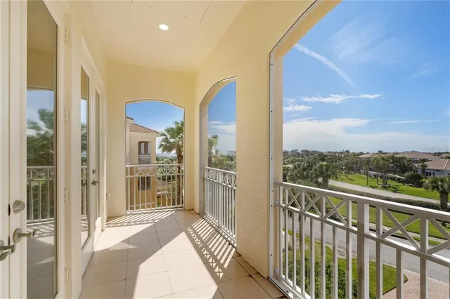 a view of a swimming pool with a patio and a garden