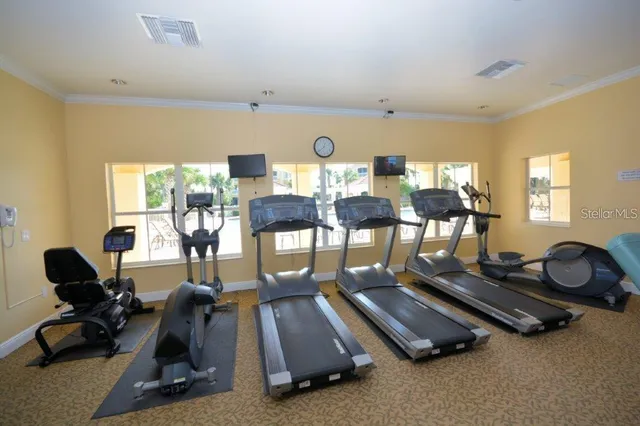 an aerial view of a house with garden space and ocean view