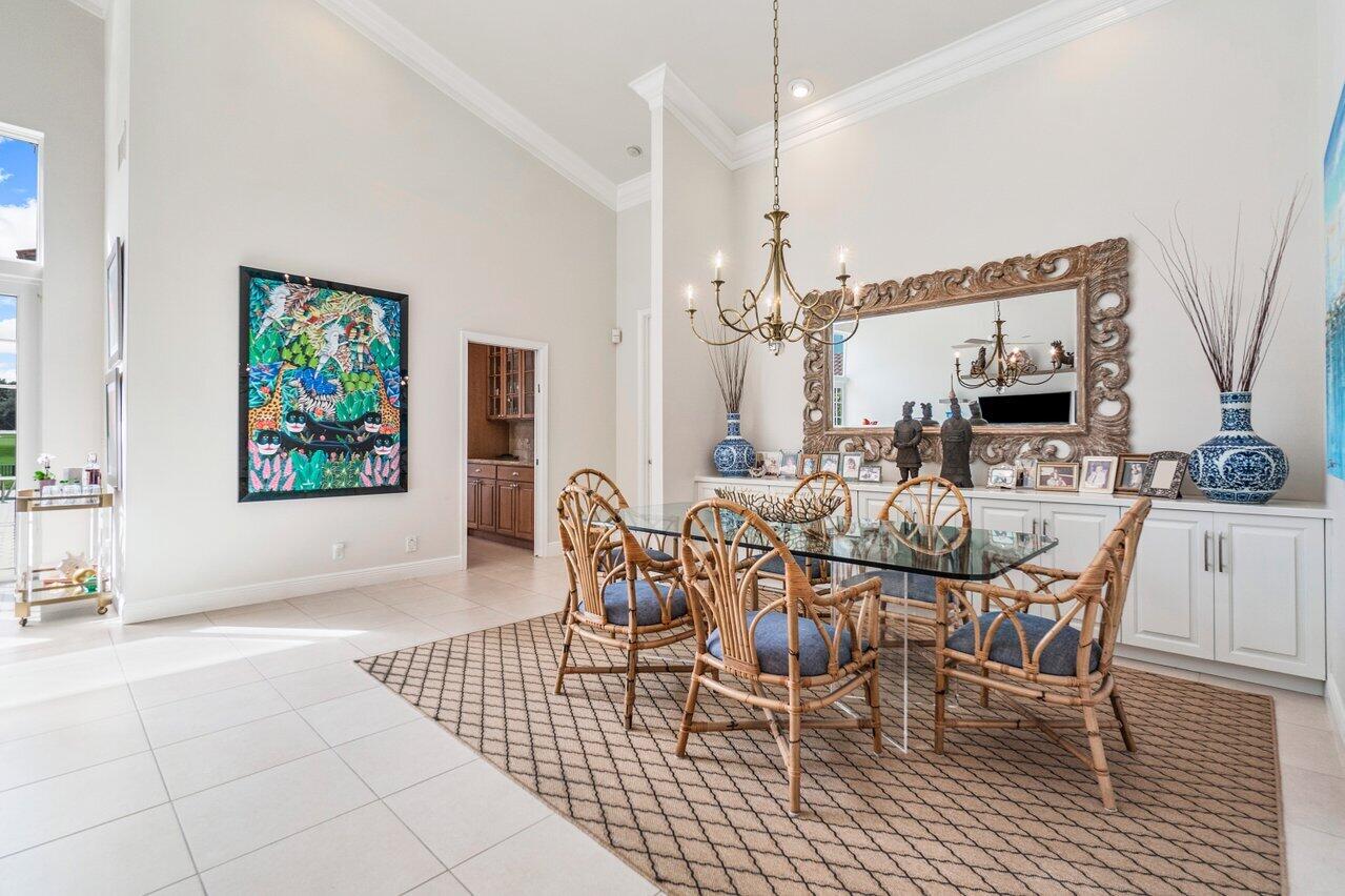 13548 Verde Drive Palm Beach Gardens, FL 33410 - Photo 12 of 43 a view of a dining room with furniture