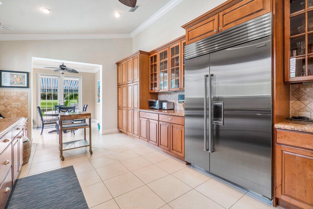 13548 Verde Drive Palm Beach Gardens, FL 33410 - Photo 14 of 43 a kitchen with stainless steel appliances a refrigerator and a stove