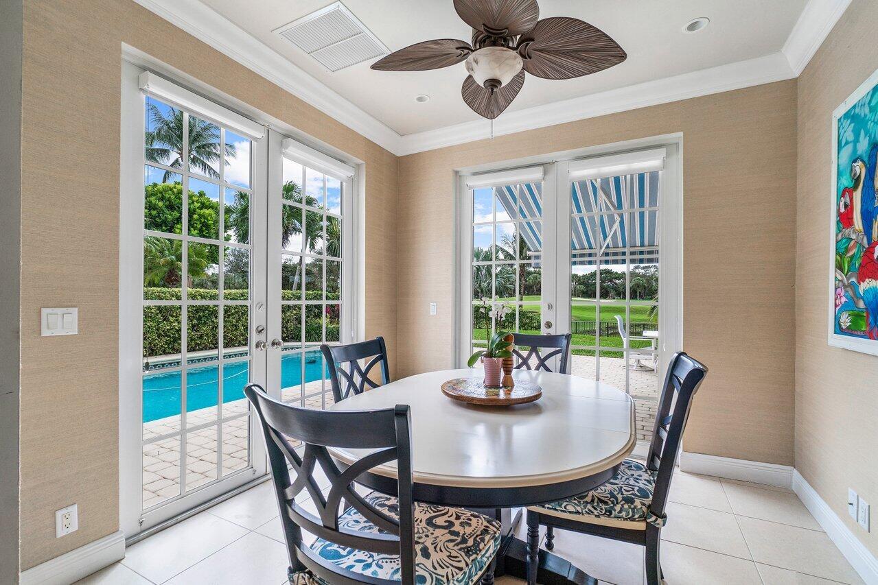 13548 Verde Drive Palm Beach Gardens, FL 33410 - Photo 16 of 43 a view of a dining room with furniture window and outside view