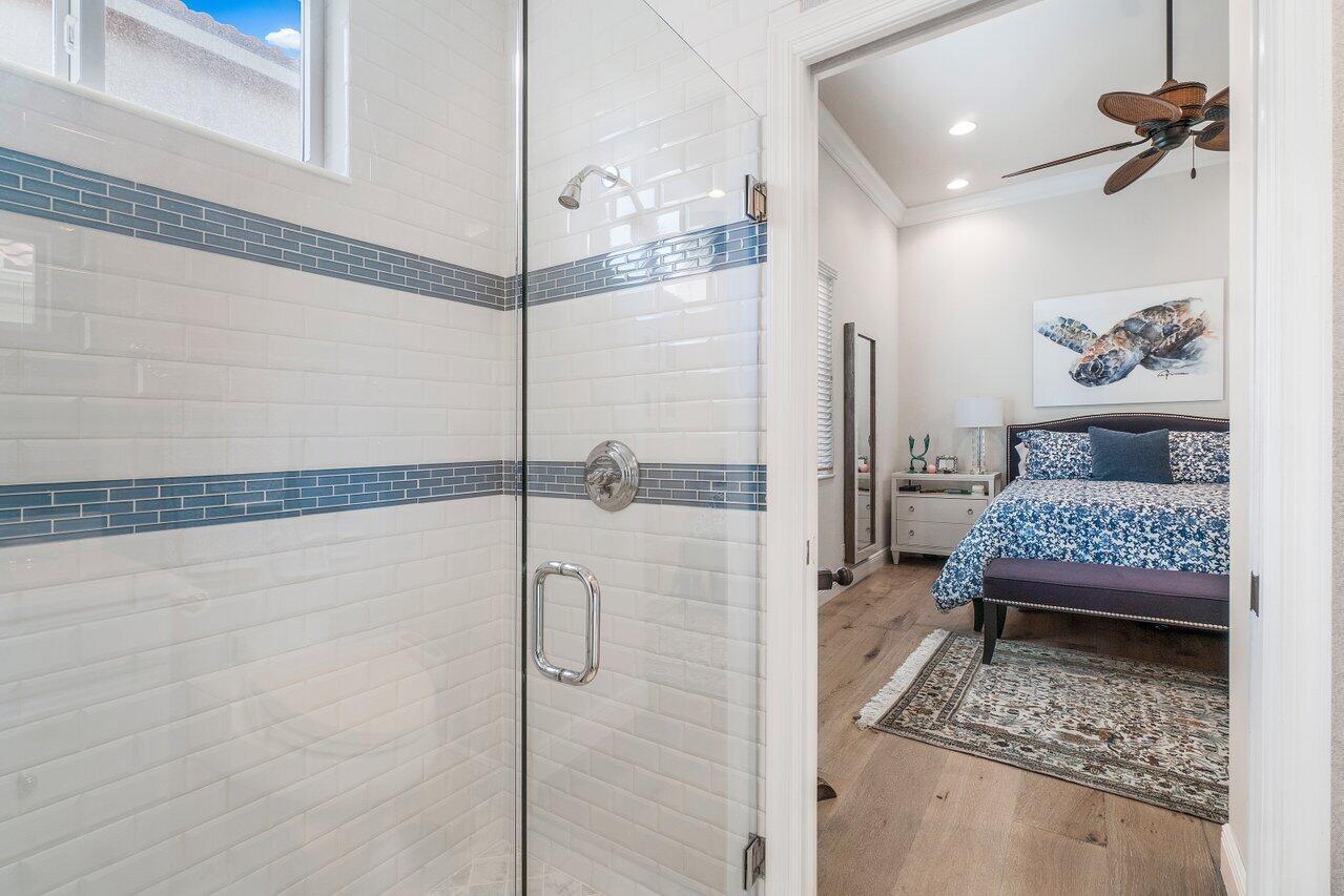 13548 Verde Drive Palm Beach Gardens, FL 33410 - Photo 24 of 43 a bedroom with a bed and a window