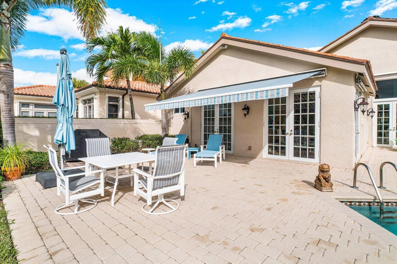 13548 Verde Drive Palm Beach Gardens, FL 33410 - Photo 29 of 43 a view of a lounge chairs with a patio