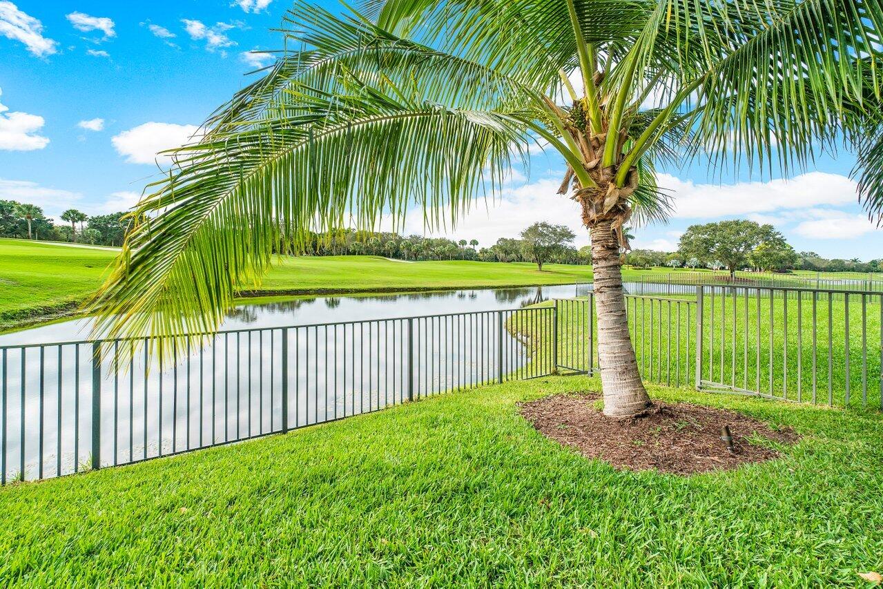 13548 Verde Drive Palm Beach Gardens, FL 33410 - Photo 34 of 43 a view of a garden with a lake