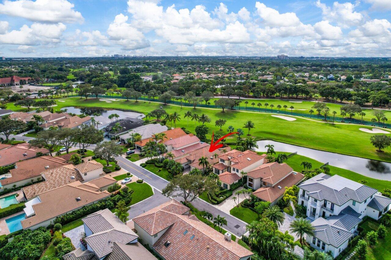 13548 Verde Drive Palm Beach Gardens, FL 33410 - Photo 38 of 43 an aerial view of a city with lots of residential buildings ocean and mountain view in back