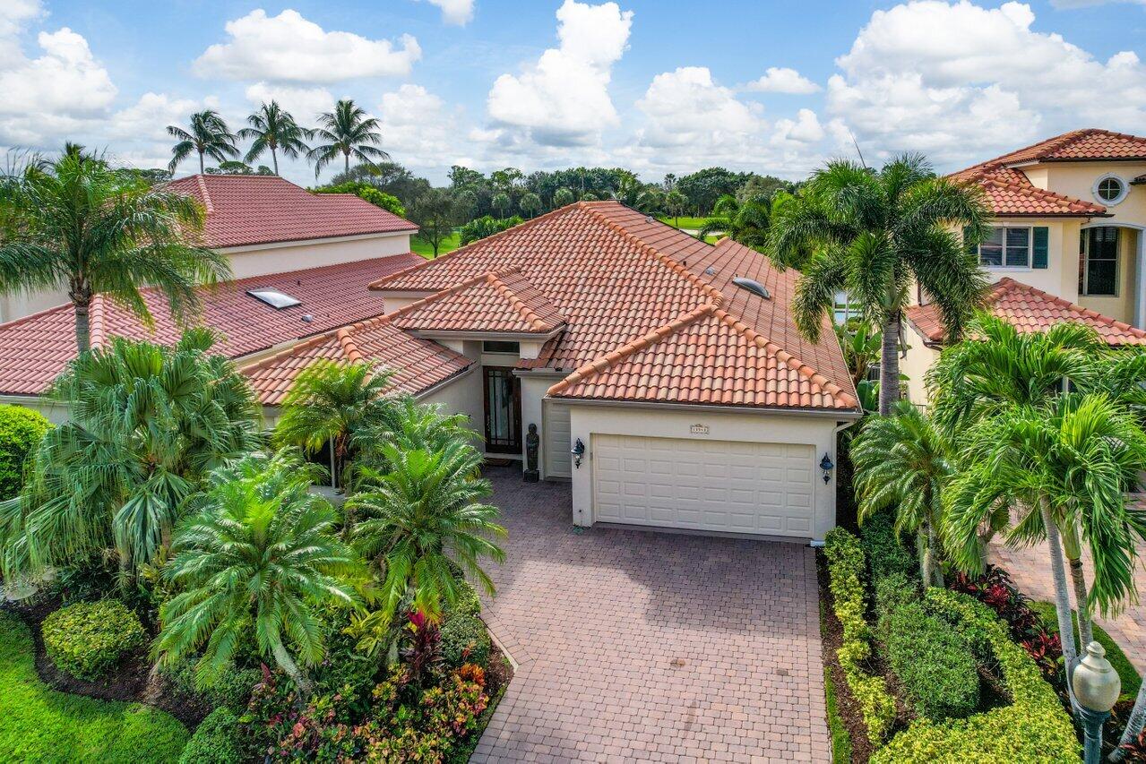 13548 Verde Drive Palm Beach Gardens, FL 33410 - Photo 41 of 43 a aerial view of a house with a garden