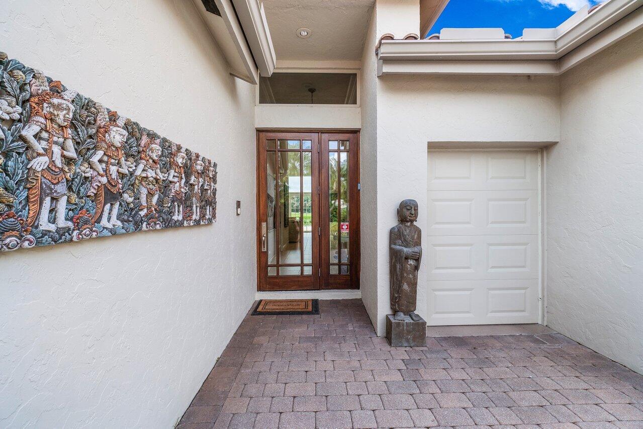 13548 Verde Drive Palm Beach Gardens, FL 33410 - Photo 6 of 43 a view of an entryway door