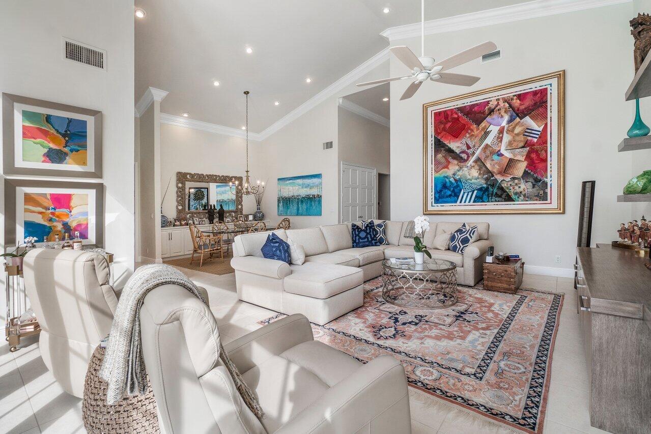 13548 Verde Drive Palm Beach Gardens, FL 33410 - Photo 8 of 43 a living room with furniture kitchen and a table