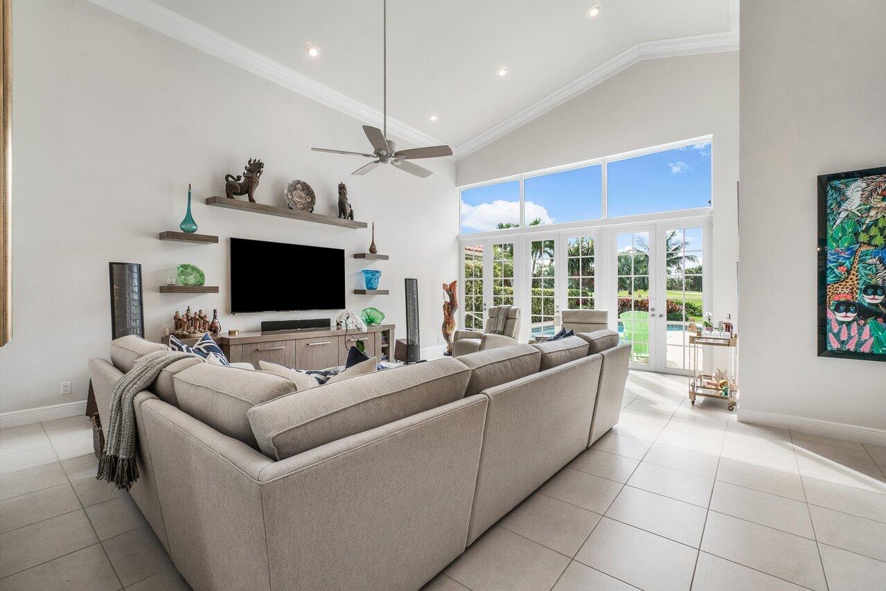 13548 Verde Drive Palm Beach Gardens, FL 33410 - Photo 10 of 43 a living room with furniture and a flat screen tv